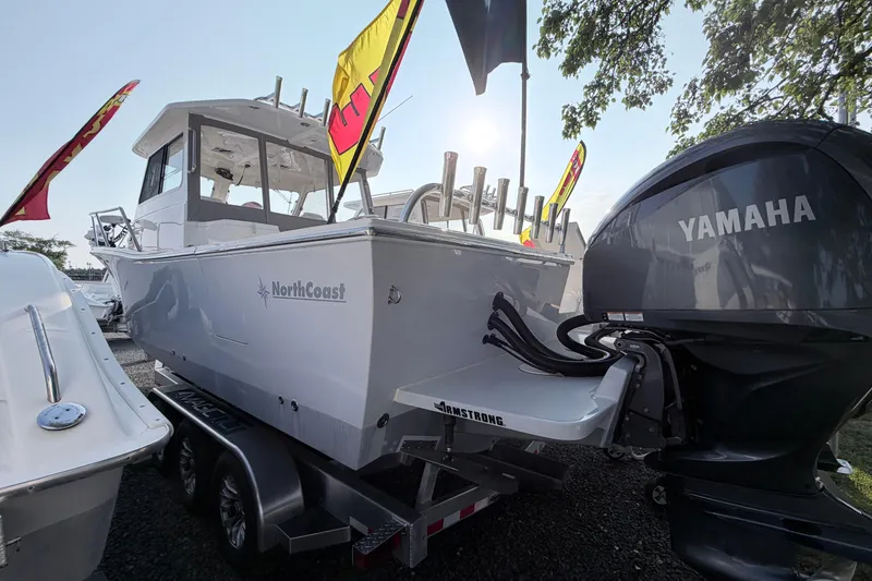 Slide: The Image of 2024 NorthCoast 315 HT boat with Yamaha engine on display, featuring sleek design and modern features. - 4