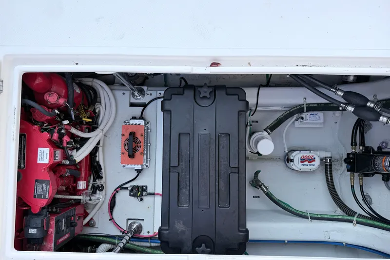 Slide: The Image of 2024 NorthCoast 315 HT engine compartment with wiring, battery, and mechanical components. - 11