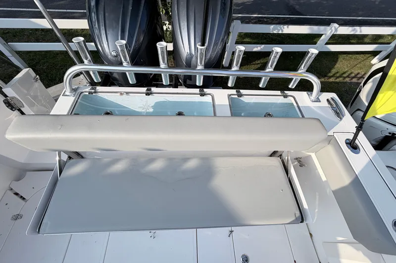 Slide: The Image of 2024 NorthCoast 315 HT boat deck with seating and rod holders. - 6