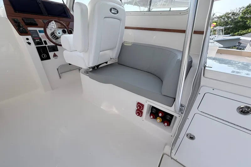 Slide: The Image of 2024 NorthCoast 315 HT boat interior with helm seat and control panel. - 14