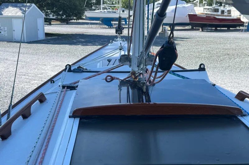 Slide: The Image of Deck view of a 1995 Alerion 28 sailboat in a boatyard. - 5