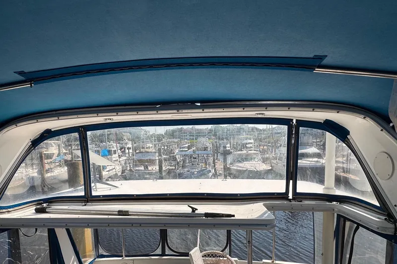 Slide: The Image of Interior view of 1988 Sea Ray 415 Aft Cabin yacht overlooking marina. - 26