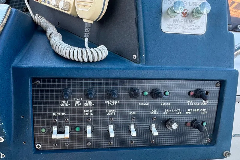 Slide: The Image of Control panel of a 1988 Sea Ray 415 Aft Cabin boat with various switches and indicators. - 17
