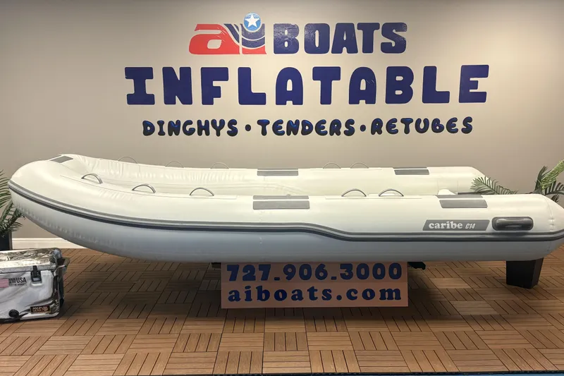 The Image of Inflatable Caribe C-14 boat displayed at aiBoats showroom, 2026 model. - 1