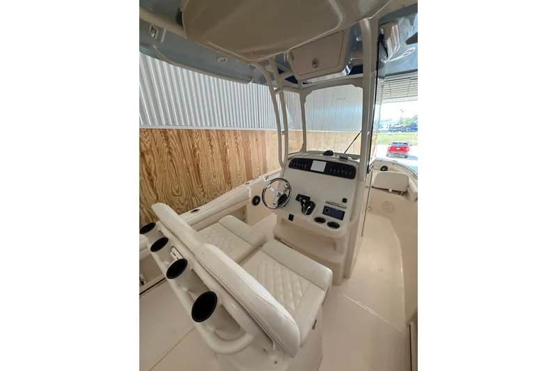 Slide: The Image of 2025 Grady-White Fisherman 216 boat interior with helm, seating, and controls. - 18