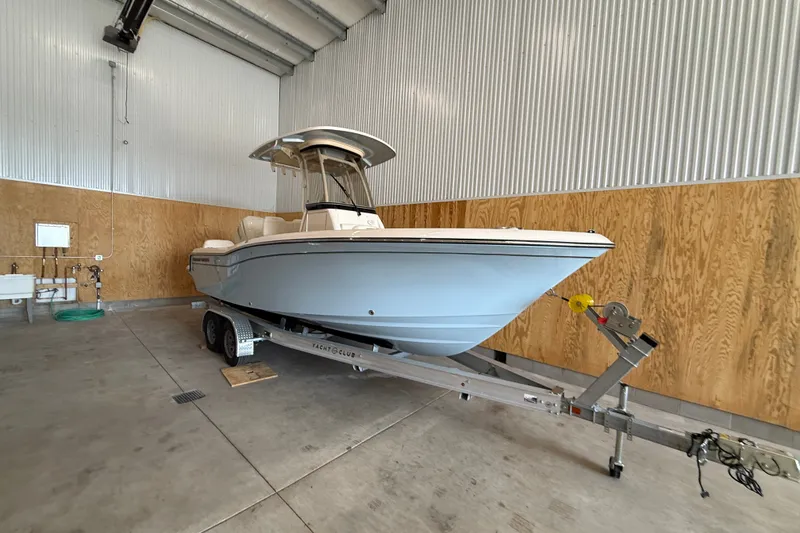 Slide: The Image of 2025 Grady-White Fisherman 216 boat on trailer in storage facility. - 6