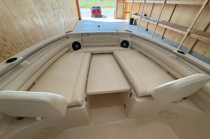 Slide: The Image of 2025 Grady-White Fisherman 216 boat interior with beige seating and storage compartments. - 13