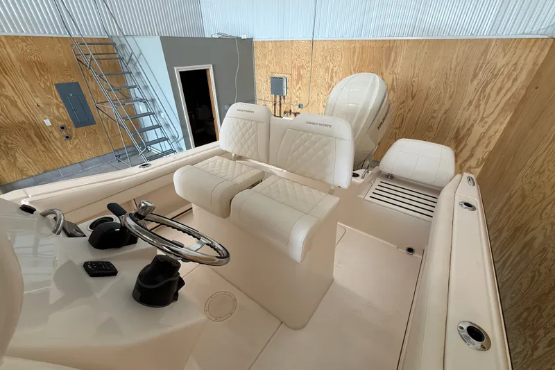 Slide: The Image of 2025 Grady-White Fisherman 216 boat interior with steering wheel and seating. - 20