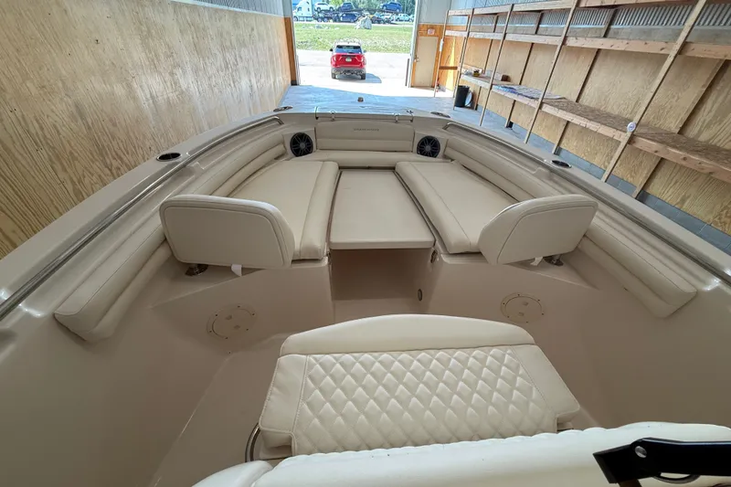 Slide: The Image of 2025 Grady-White Fisherman 216 boat interior with cushioned seating in a storage area. - 12