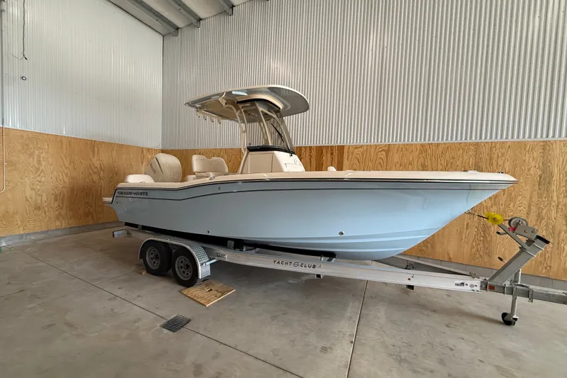 Slide: The Image of 2025 Grady-White Fisherman 216 boat on trailer in indoor storage. - 1
