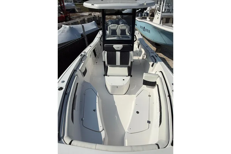 Slide: The Image of 2026 Tidewater 256 CC Adventure boat interior with seating and storage compartments. - 3