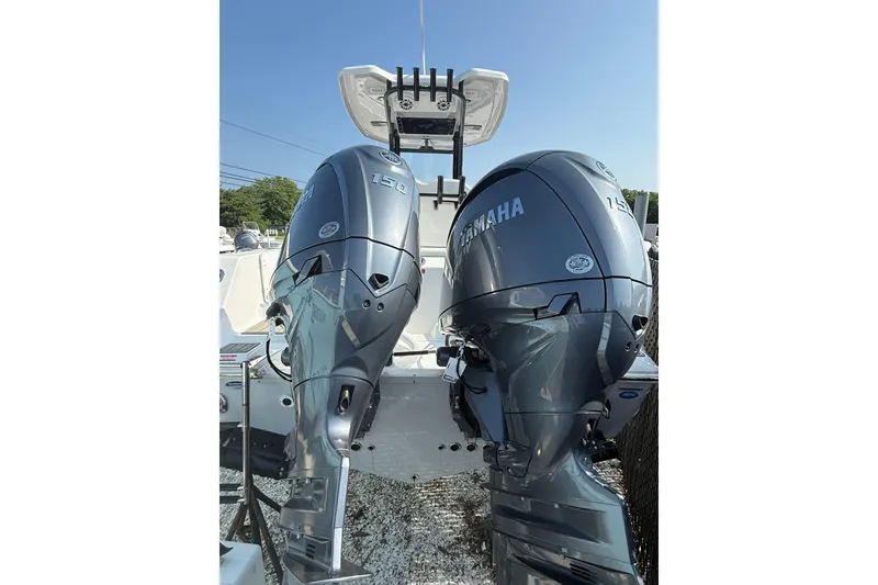Slide: The Image of 2026 Tidewater 256 CC Adventure boat with dual Yamaha 150 outboard engines. - 12