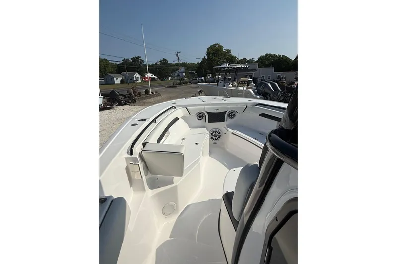 Slide: The Image of 2026 Tidewater 256 CC Adventure boat interior with seating and storage compartments. - 6