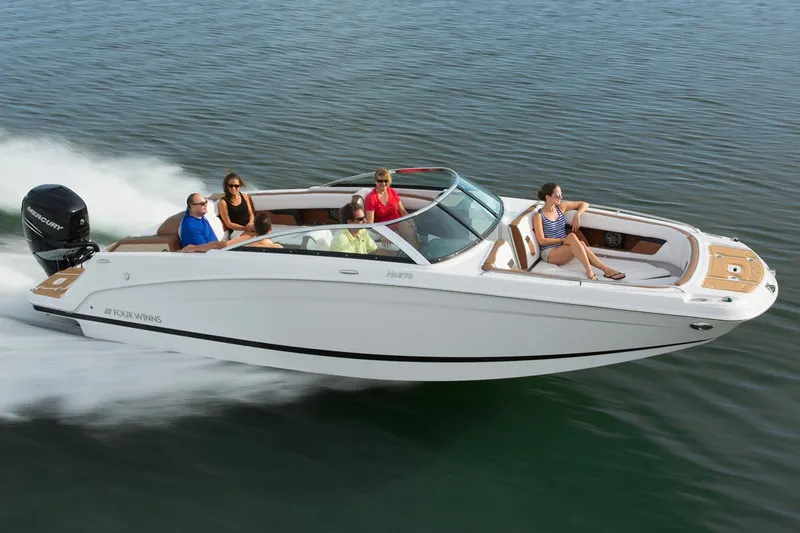 The Image of Manufacturer Provided Image: 2018 Four Winns HD270 OB boat cruising with passengers on a calm lake. - 0
