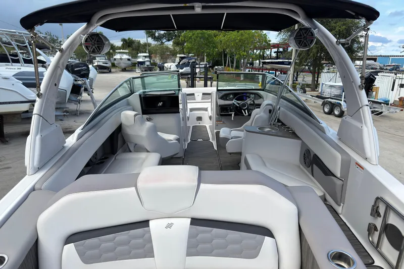 Slide: The Image of 2018 Four Winns HD270 OB boat interior with spacious seating and modern design. - 1