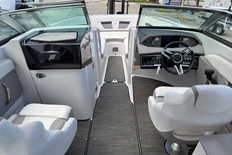 Slide: The Image of Interior of 2018 Four Winns HD270 OB boat with modern steering and seating. - 5