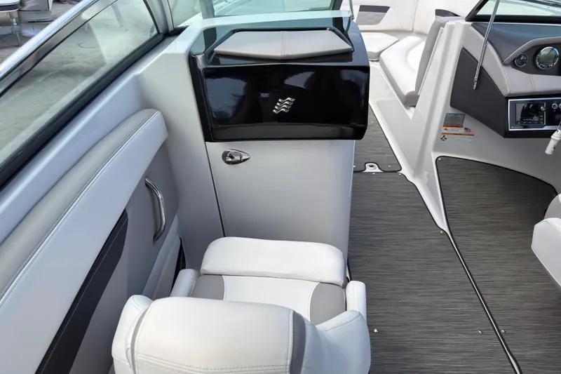Slide: The Image of 2018 Four Winns HD270 OB boat interior with sleek seating and modern dashboard design. - 4