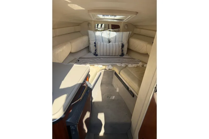 Slide: The Image of Interior cabin of 2006 Sea Ray 240 Sundancer with cozy seating and cushions. - 14