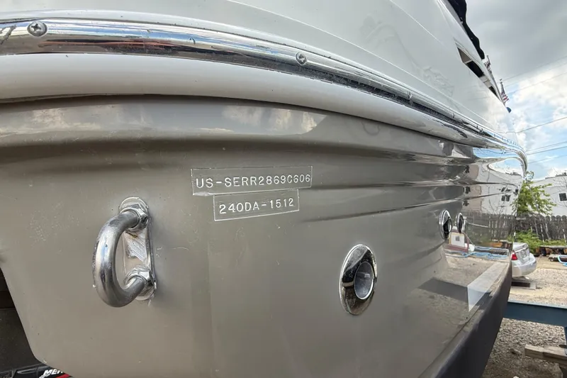 Slide: The Image of 2006 Sea Ray 240 Sundancer boat hull with identification numbers visible. - 25