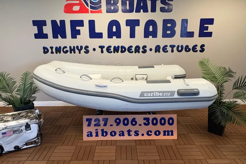 The Image of Inflatable Caribe C-9X boat displayed at AI Boats showroom, 2026 model. - 1