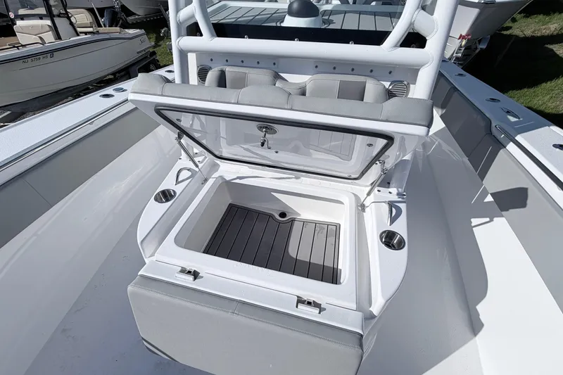 Slide: The Image of 2026 Cape Horn 39XS boat interior with open storage compartment and seating. - 14