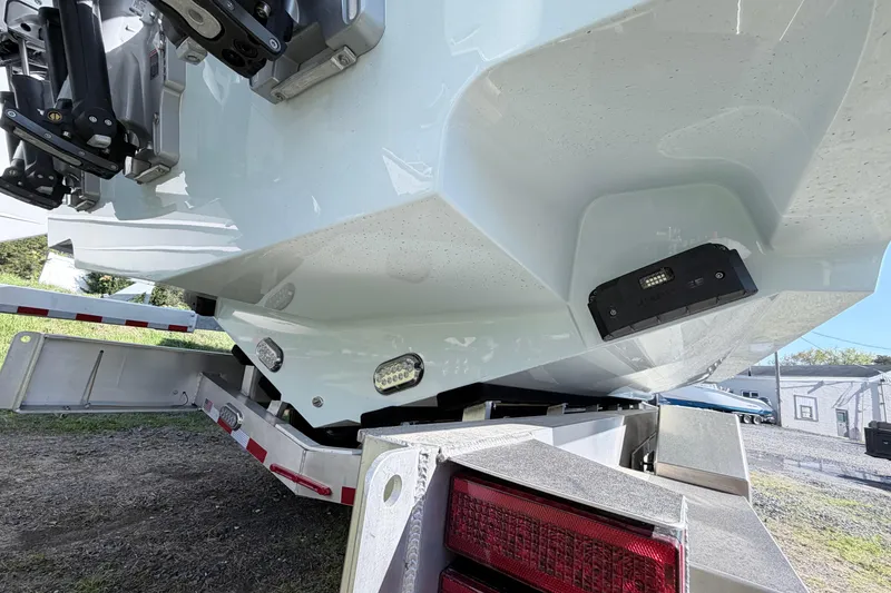 Slide: The Image of 2026 Cape Horn 39XS boat on trailer, showcasing hull and lighting details. - 5