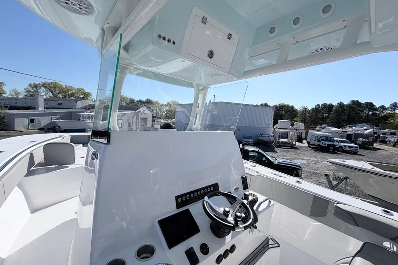 Slide: The Image of 2026 Cape Horn 39XS boat helm with modern controls and sleek design. - 8