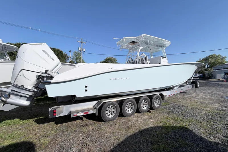Slide: The Image of 2026 Cape Horn 39XS boat on trailer, featuring Mercury outboard engines. - 2