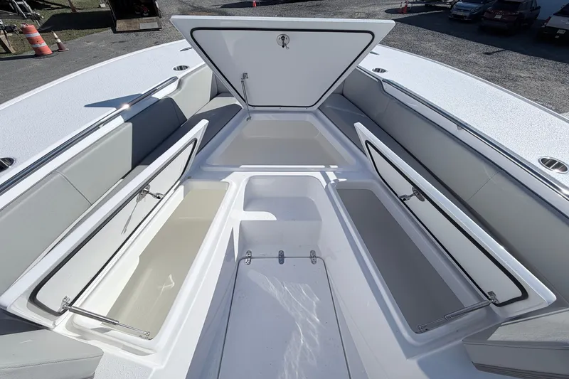 Slide: The Image of 2026 Cape Horn 39XS boat storage compartments open, showcasing spacious interior design. - 17