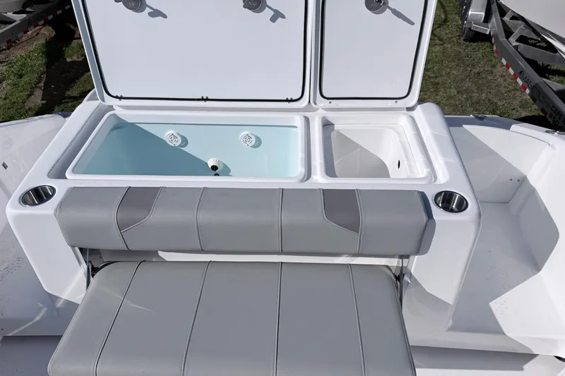 Slide: The Image of 2026 Cape Horn 39XS boat with open storage compartments and cushioned seating. - 19
