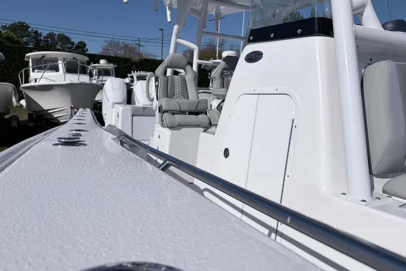 Slide: The Image of 2026 Cape Horn 39XS boat, sleek white design, luxury seating, outdoor display. - 31