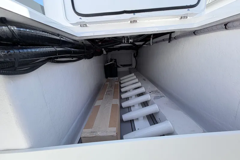 Slide: The Image of Storage compartment of 2026 Cape Horn 39XS boat, featuring organized cables and equipment. - 22