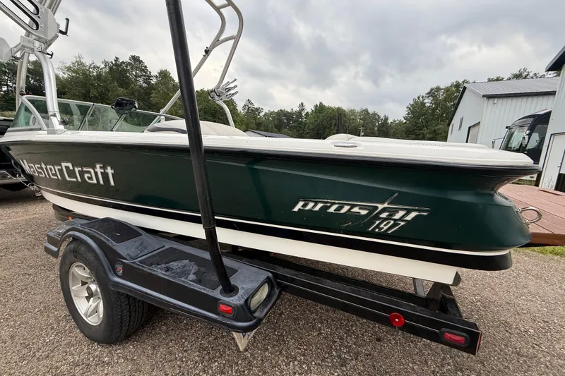 Slide: The Image of 2005 MasterCraft ProStar 197 boat on trailer, parked outdoors. - 5