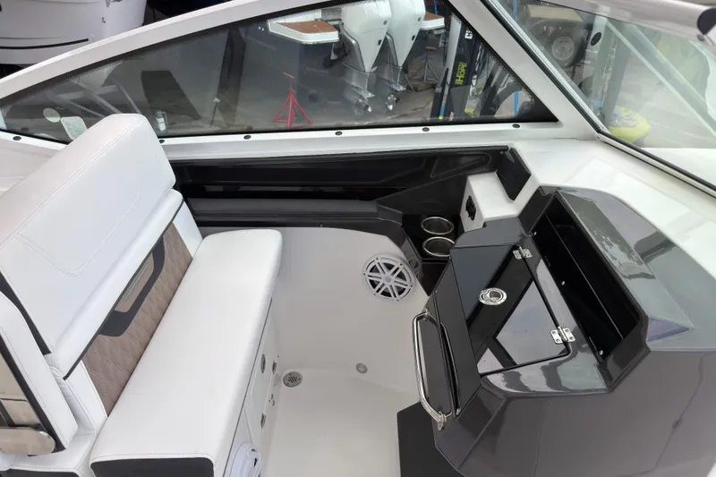 Slide: The Image of Interior of 2023 Blackfin 272 DC boat, featuring seating and storage compartments. - 9