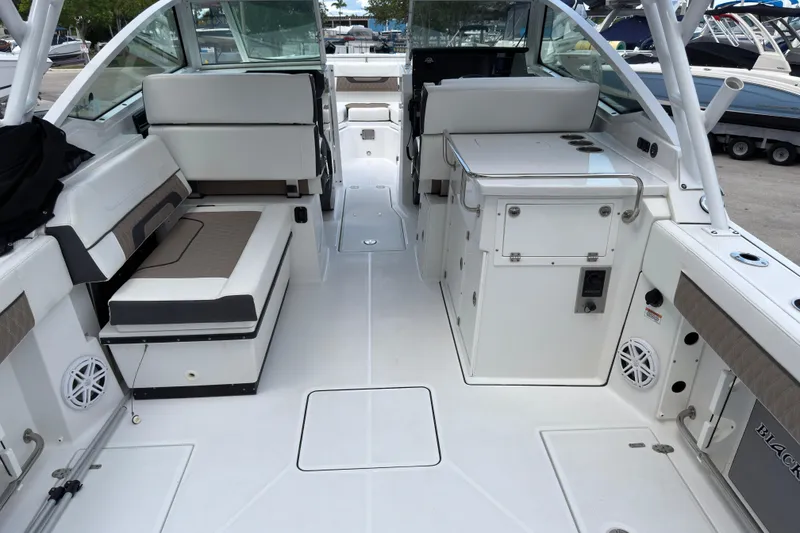 Slide: The Image of 2023 Blackfin 272 DC boat interior with seating and storage compartments. - 6