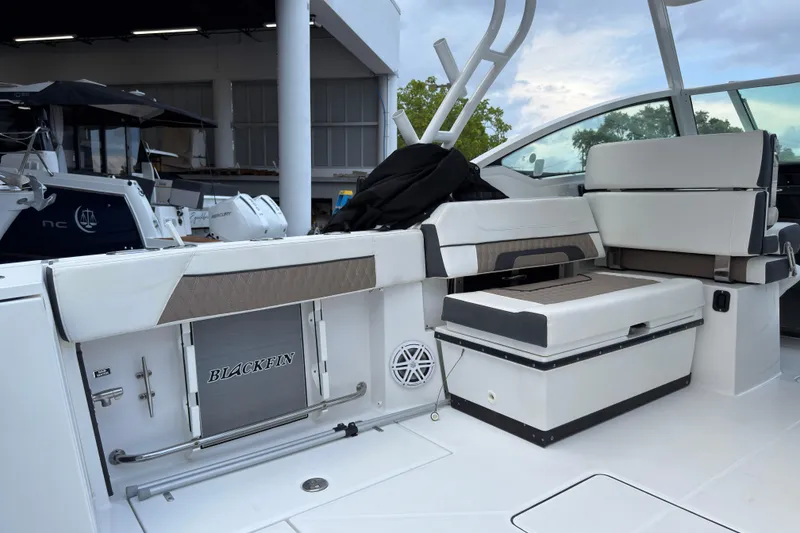 Slide: The Image of 2023 Blackfin 272 DC boat interior with seating and storage features. - 8