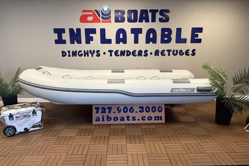 The Image of Inflatable Caribe C-13 boat displayed at AI Boats showroom, 2026 model. - 1