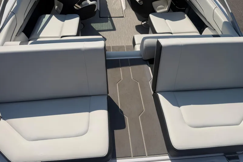 Slide: The Image of Interior view of a 2019 Regal 2100 boat featuring sleek, modern seating design. - 27