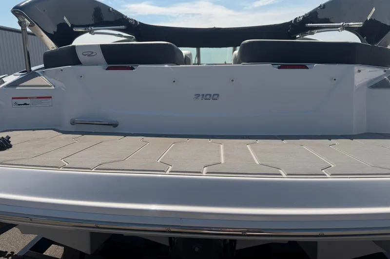 Slide: The Image of 2019 Regal 2100 boat rear view with swim platform and seating. - 19