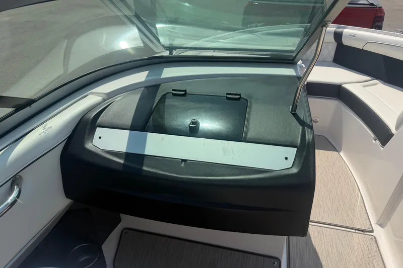 Slide: The Image of 2019 Regal 2100 boat interior with windshield and seating area. - 18
