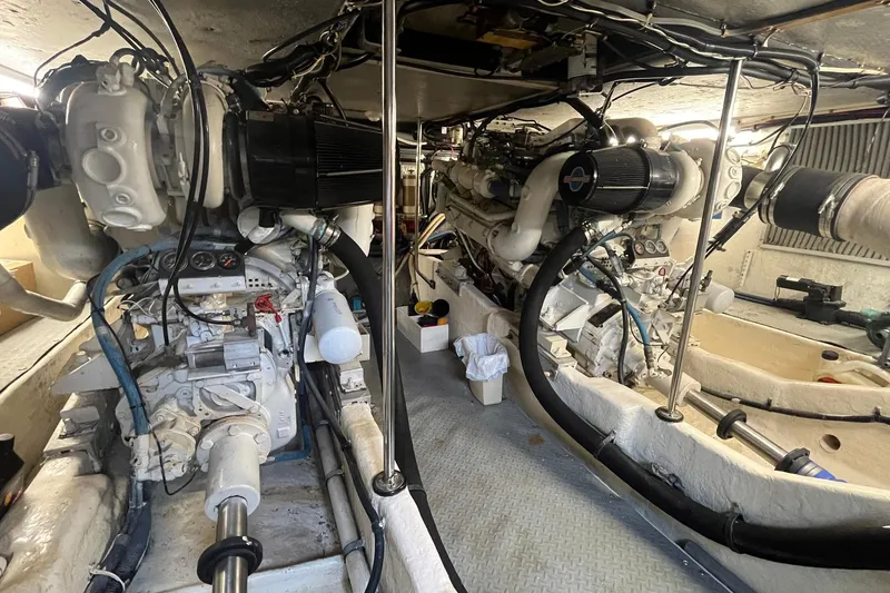 Slide: The Image of Engine room of a 1996 Sea Ray 500 Sedan Bridge yacht, showcasing dual engines. - 20