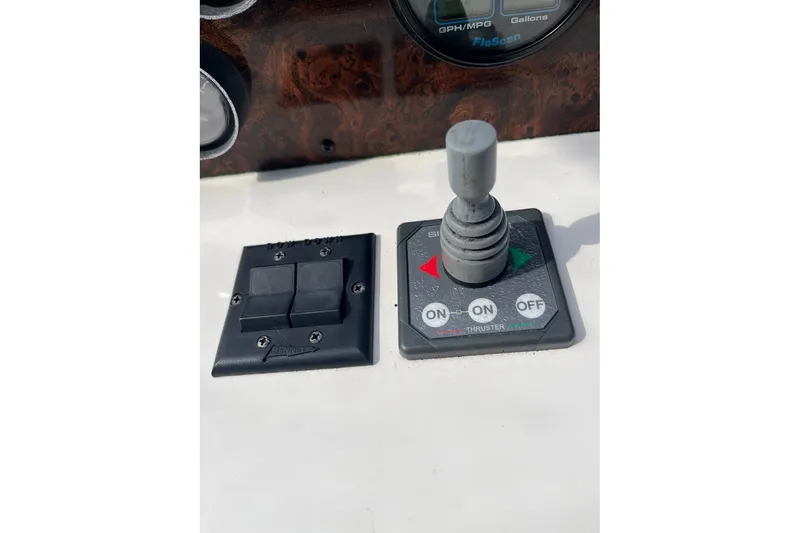 Slide: The Image of Control panel of a 1996 Sea Ray 500 Sedan Bridge with joystick and switches. - 29