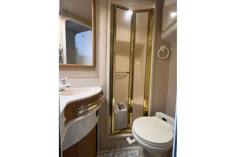 Slide: The Image of Bathroom interior of 1996 Sea Ray 500 Sedan Bridge yacht with shower and toilet. - 10