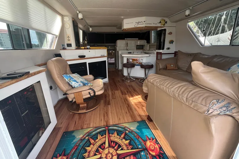 Slide: The Image of Luxurious interior of a 1996 Sea Ray 500 Sedan Bridge yacht with cozy seating and modern amenities. - 3