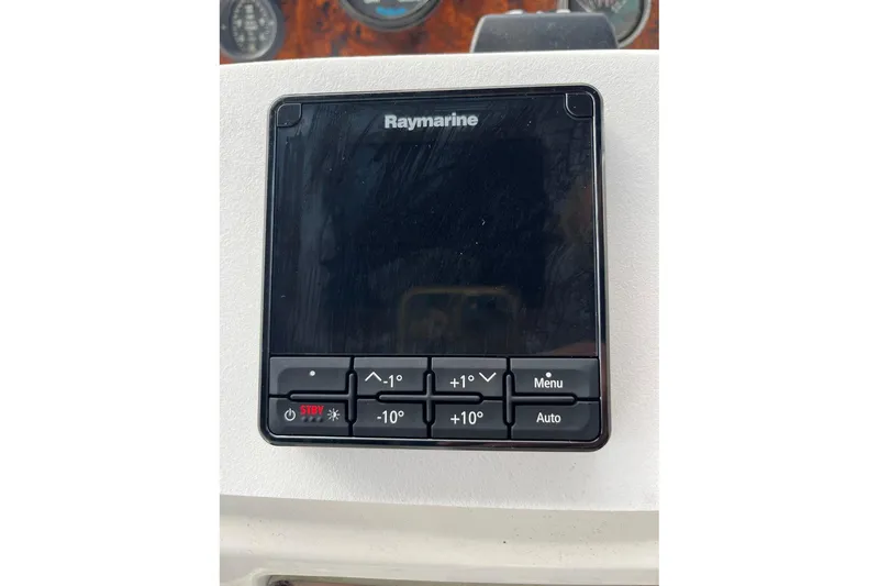 Slide: The Image of Raymarine control panel on 1996 Sea Ray 500 Sedan Bridge yacht dashboard. - 28