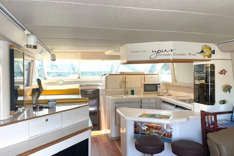 Slide: The Image of Luxurious interior of a 1996 Sea Ray 500 Sedan Bridge yacht with modern amenities. - 16