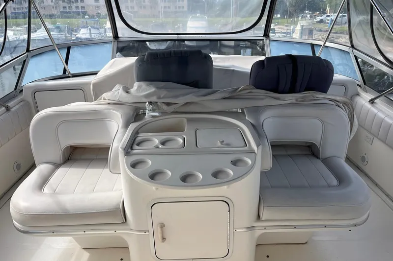Slide: The Image of Interior of a 1996 Sea Ray 500 Sedan Bridge yacht with seating and cup holders. - 25