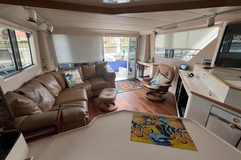 Slide: The Image of Interior of 1996 Sea Ray 500 Sedan Bridge with leather seating and modern decor. - 4