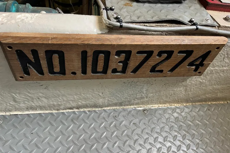 Slide: The Image of Wooden boat registration plaque on 1996 Sea Ray 500 Sedan Bridge, number NO.1037274. - 18
