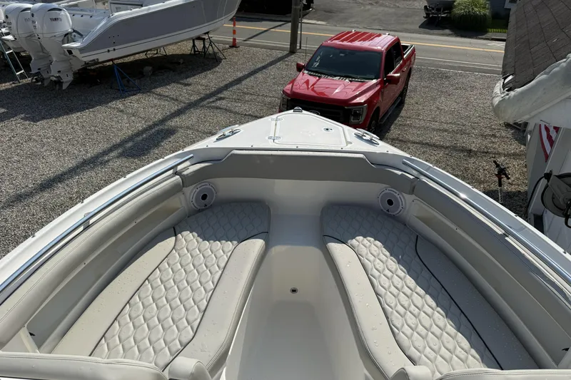 Slide: The Image of 2027 Pursuit DC 266 Dual Console boat with luxurious seating and sleek design. - 11